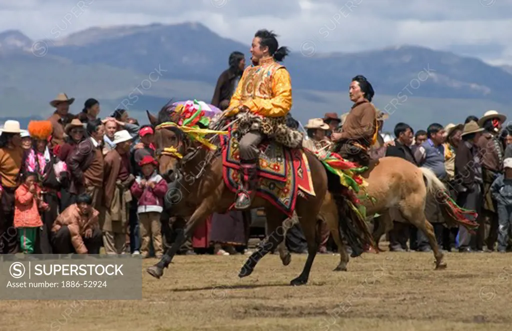 A Khampa participates in the dressage competition at the Litang Horse Festival in Kham - Sichuan Province, China, (Tibet)