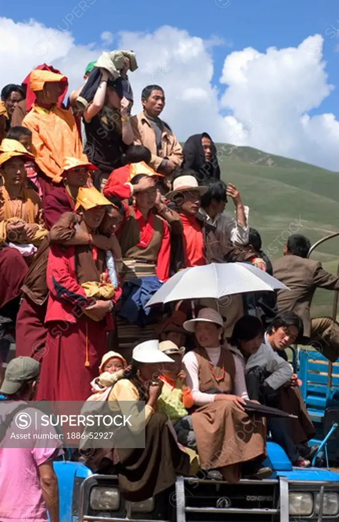 Crowd uses truck as a viewing platform at the Litang Horse Festival in Kham - Sichuan Province, China, (Tibet)