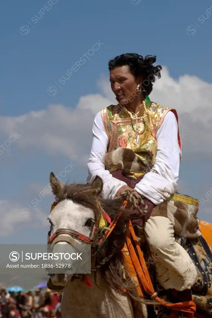 Khampas, the warrior horseman of old Tibet,  compete at the Litang Horse Festival - Kham, Sichuan Province, China, (Tibet)