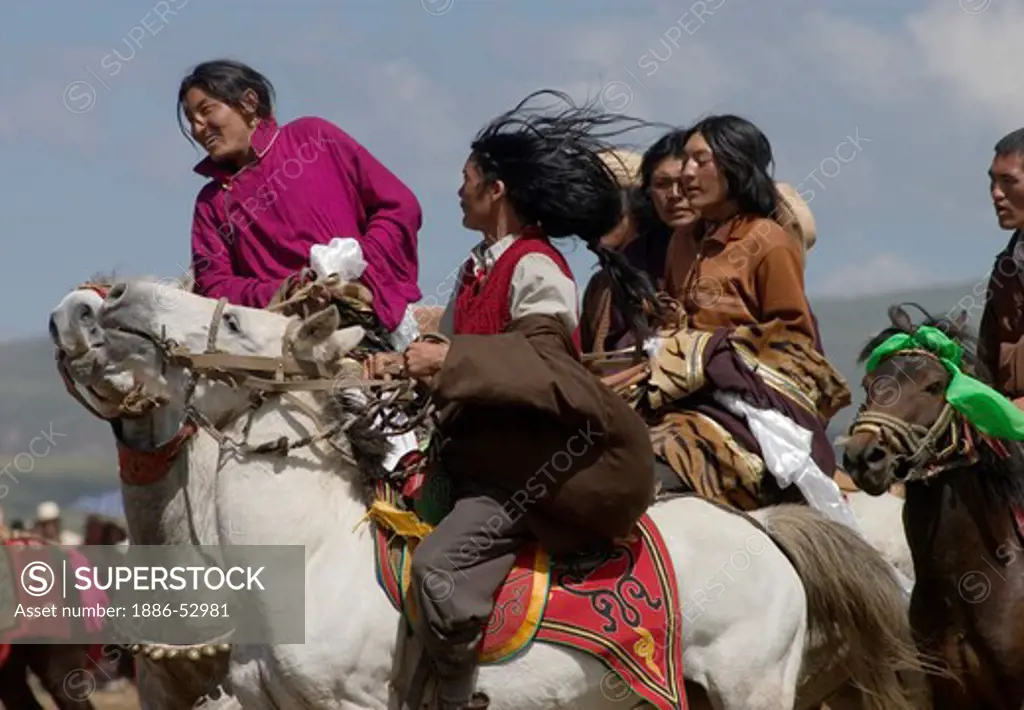 Khampas, the warrior horseman of old Tibet,  compete at the Litang Horse Festival - Kham, Sichuan Province, China, (Tibet)