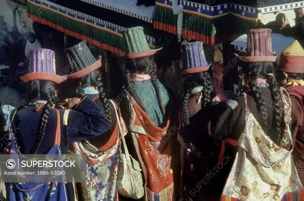 Ladakhi women wearing traditional SILK EMBROIDERED TALL HATS, TIKSE Monastery Masked Dances - LADAKH, INDIA