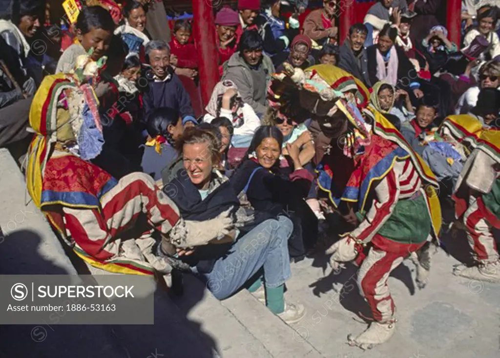 SKULL MASK DANCERS, play with a TOURIST for comic relief, TIKSE Monastery Masked Dances - LADAKH, INDIA