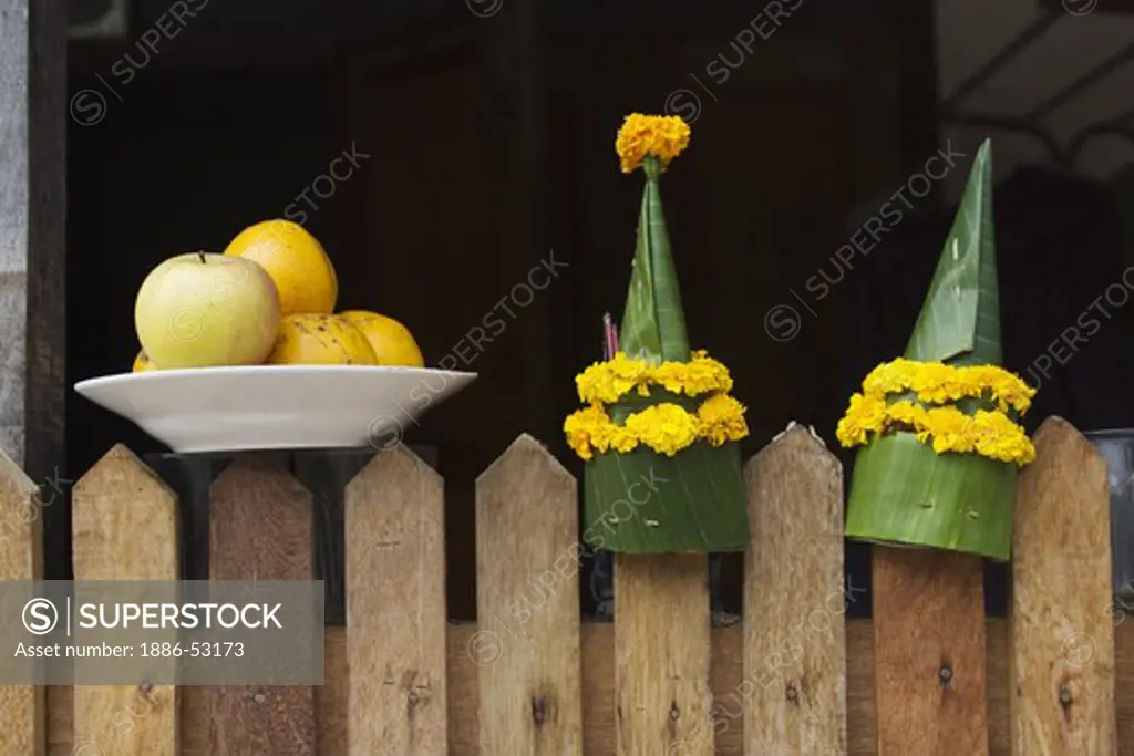 Fruit and flower offering in the former French Provincial town of LUANG PROBANG - LAOS