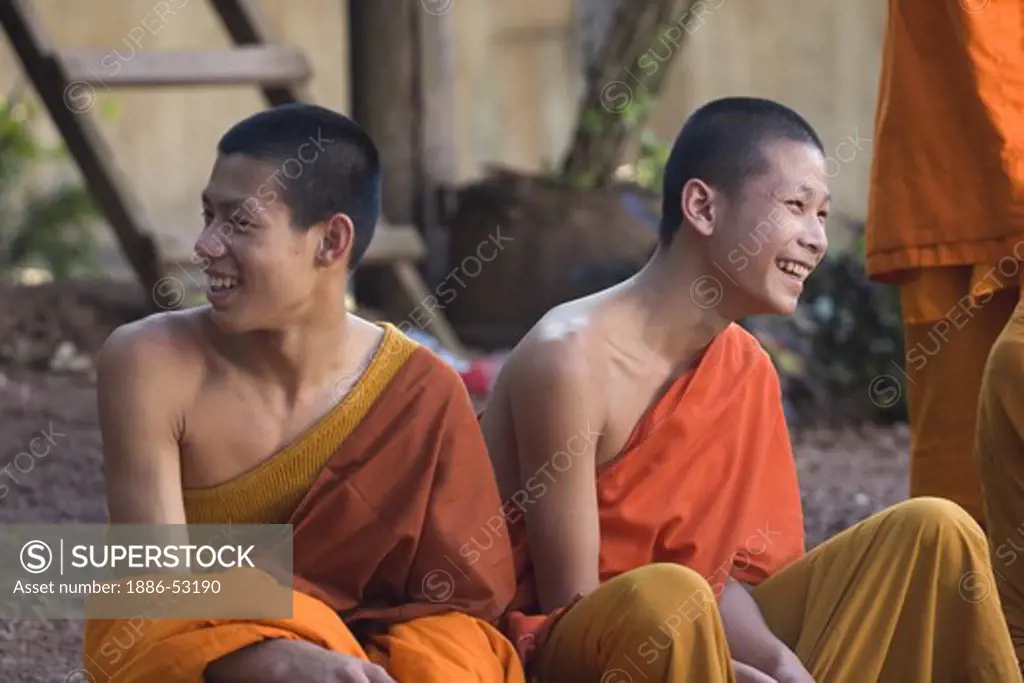 Hinayana Buddhist monks at Wat Pa Huak in the former French Provincial town of LUANG PROBANG - LAOS