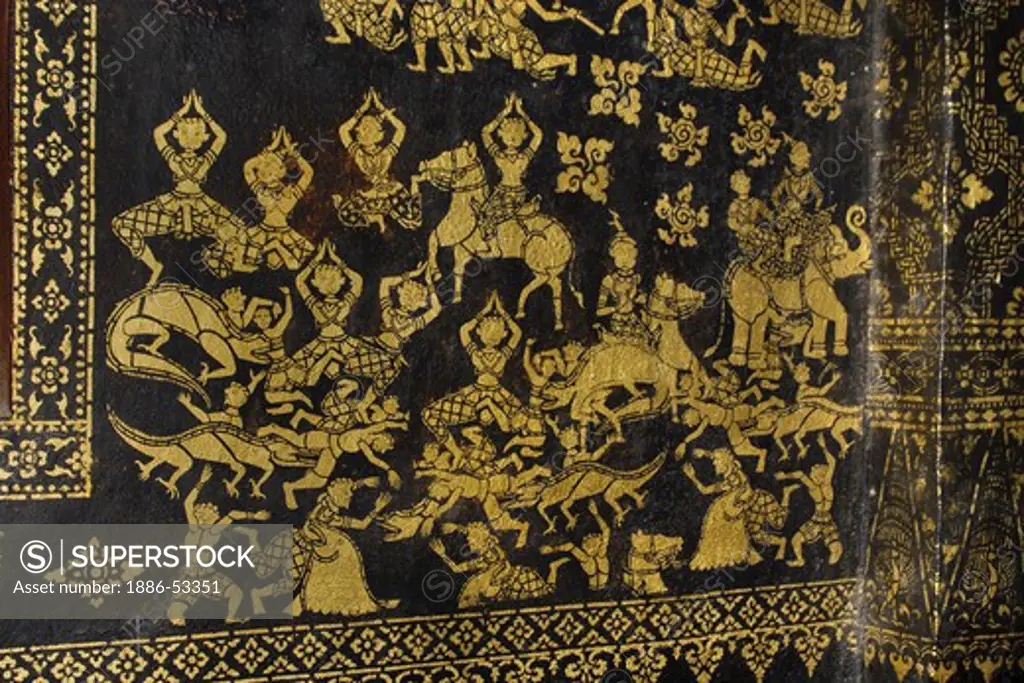 Gold stencil art of the various realms of existence inside the Buddhist Temple Wat Xieng Thong, built by King Setthatthirat in 1560 - LUANG PROBANG, LAOS
