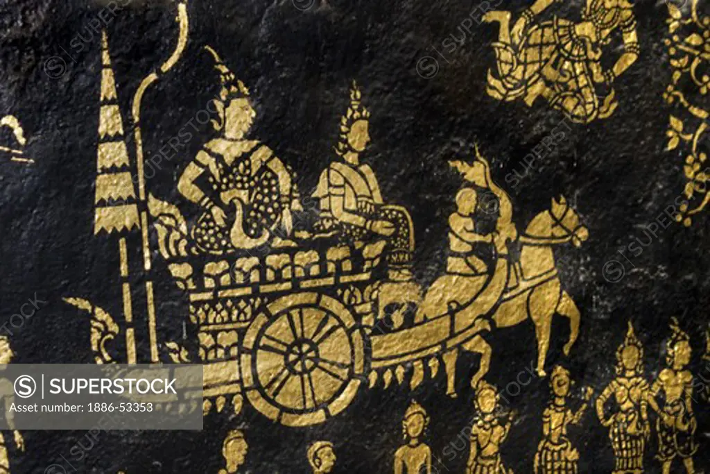 Gold stencil art of Khmer King in a carriage inside the Buddhist Temple Wat Xieng Thong, built by King Setthatthirat in 1560 - LUANG PROBANG, LAOS