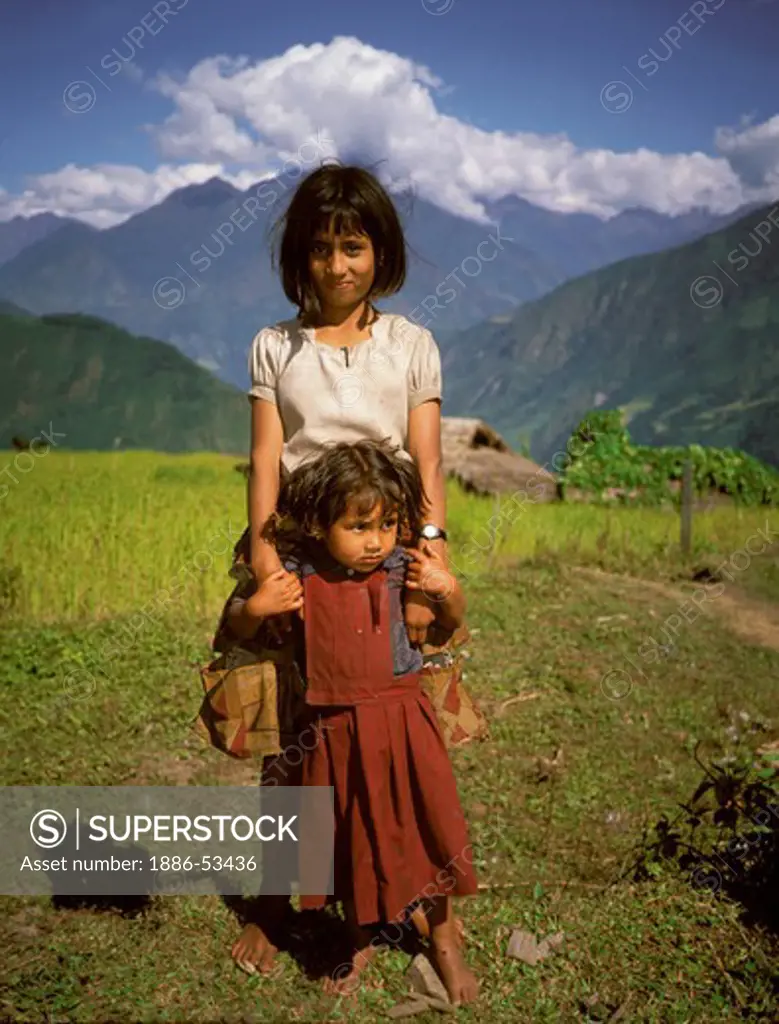 NEPALI GIRLS on a farm in the middle hills east of the ARUN RIVER on the trail to MAKALU - EASTERN NEPAL