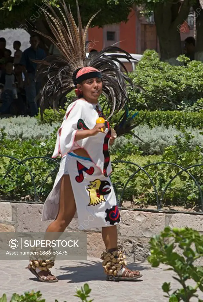 A young woman dressed up as a Mayan Indian during the carrying of the Virgin of La Paz through the streets of SAN MIGUEL DE ALLENDE - MEXICO