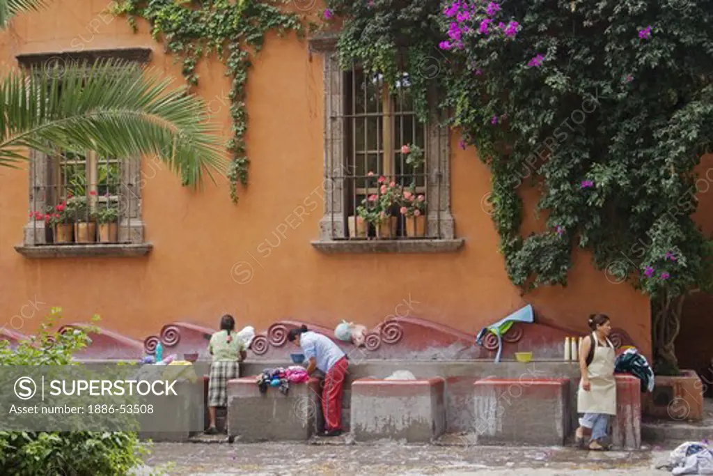 Mexican women still use the historic outdoor washing area to do their laundry in San Miguel de Allende - MEXICO