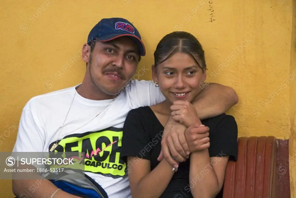 Hip young Mexican couple at the Instituto de Culturo (Cultural Institute) in San Miguel de Allende - MEXICO
