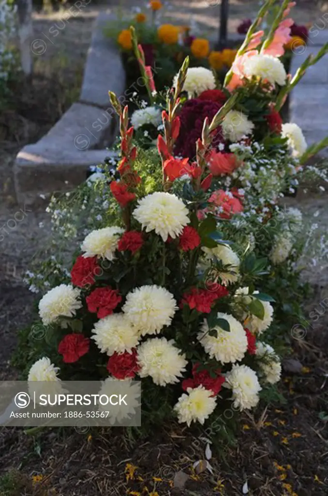FLOWER arrangement on a grave at the local cemetery during the DEAD OF THE DEAD - SAN MIGUEL DE ALLENDE, MEXICO