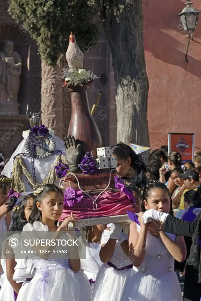 MEXICAN ANGELS with float leave TEMPLO DEL ORATORIO DE SAN FELIPE NERI during EASTER PROCESSION - SAN MIGUEL DE ALLENDE, MEXICO
