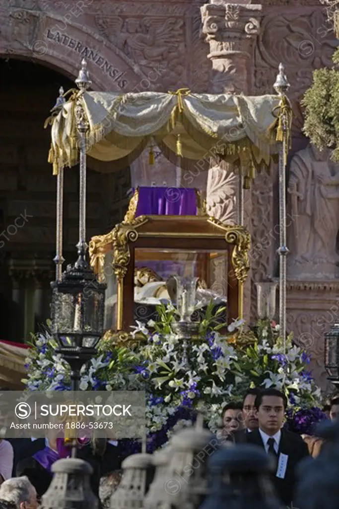 MEXICAN MEN carry CHRIST in his casket from TEMPLO DEL ORATORIO during EASTER PROCESSION - SAN MIGUEL DE ALLENDE, MEXICO
