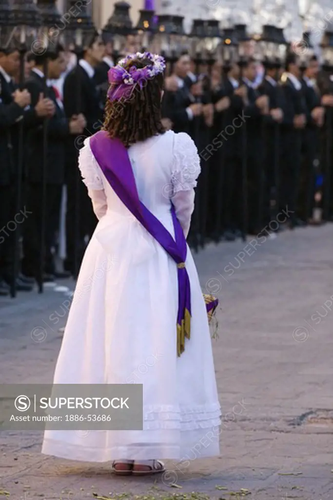 MEXICAN GIRL throws flowers during EASTER PROCESSION commencing at TEMPLO DEL ORATORIO - SAN MIGUEL DE ALLENDE, MEXICO