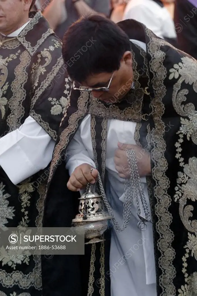 PRIESTS with incense burner during the EASTER PROCESSION - SAN MIGUEL DE ALLENDE, MEXICO