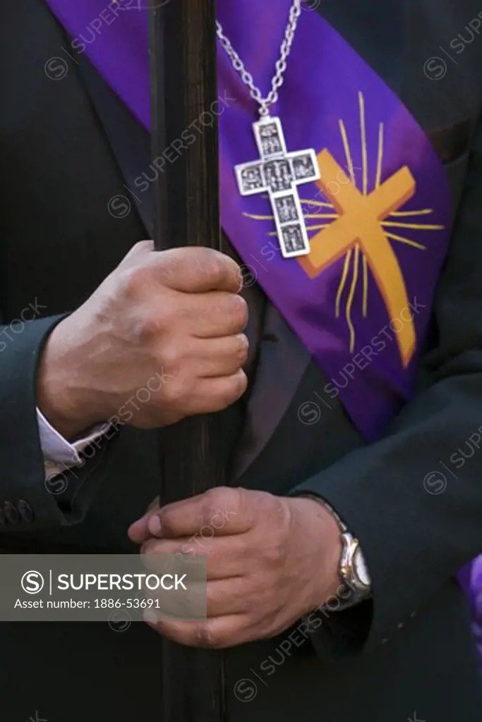 PRIEST holds a staff during the EASTER PROCESSION - SAN MIGUEL DE ALLENDE, MEXICO