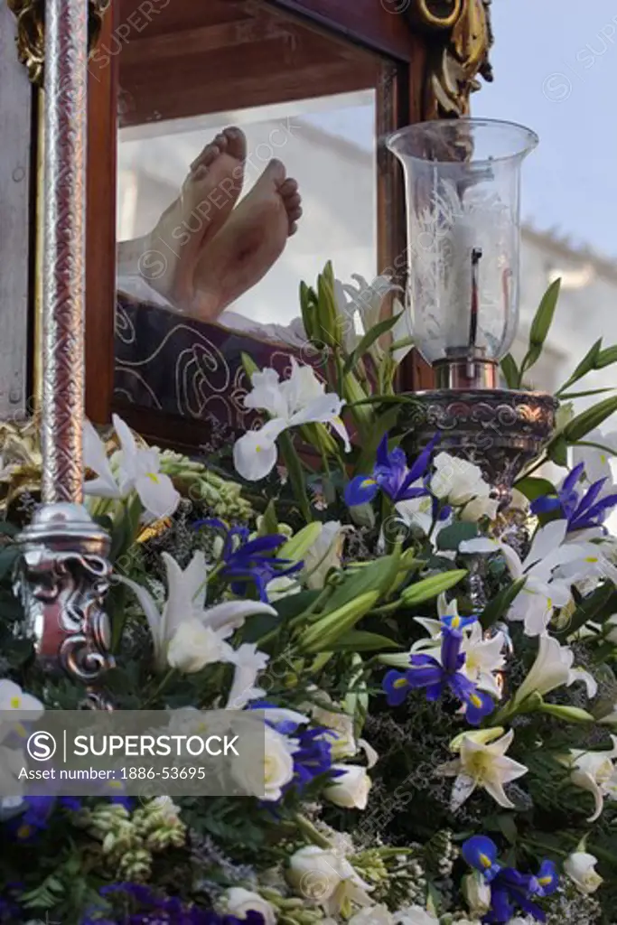 CHRIST'S FEET with flowers during the EASTER PROCESSION - SAN MIGUEL DE ALLENDE, MEXICO