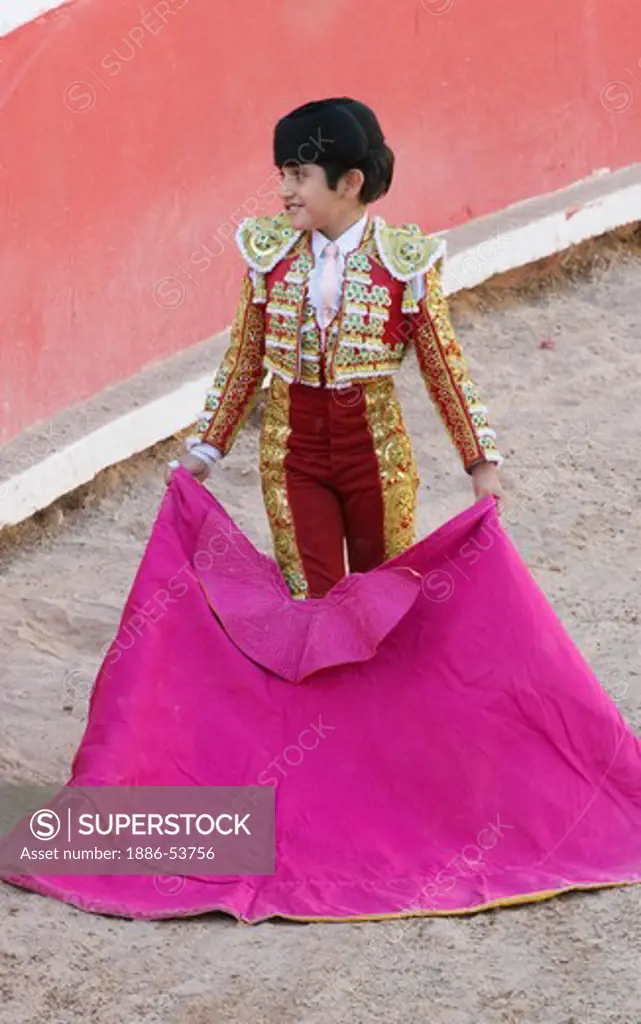 The 9 year old child matador RAFITA MIRABAL fights a bull in the Plaza de Toros - SAN MIGUEL DE ALLENDE, MEXICO