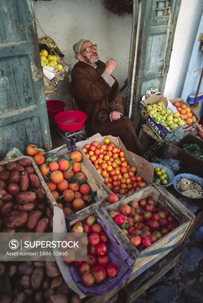 PRODUCE MERCHANT in the town of CHECHAOUEN in the RIF MOUNTAINS of northern MOROCCO