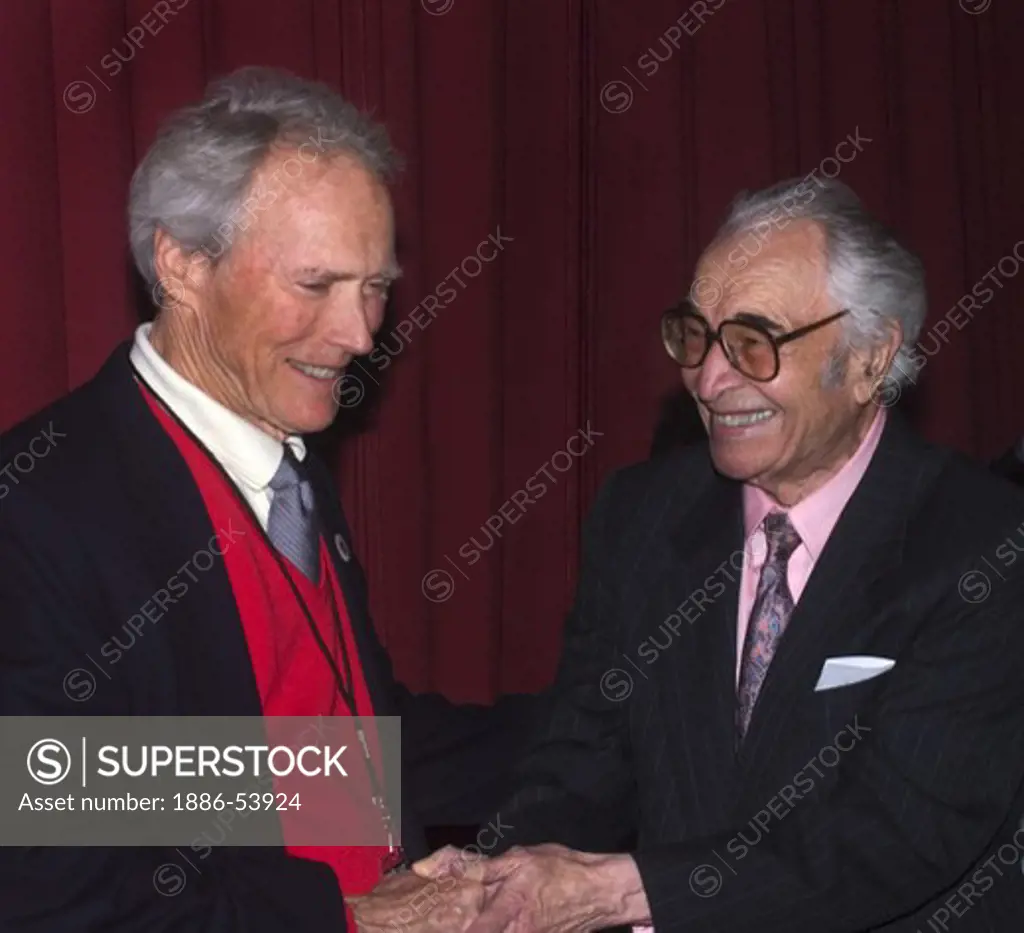 CLINT EASTWOOD & DAVE BRUBECK shake hands backstage at THE MONTEREY JAZZ FESTIVAL