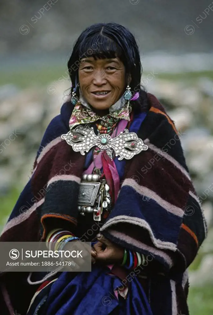 Beautiful WOMAN with DORJE CLASP attends a summer festival in the  DO TARAP VALLEY - DOLPO DISTRICT, NEPAL