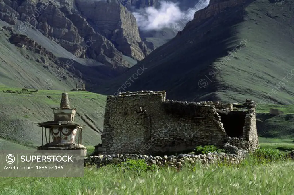 Tibetan Buddhist CHORTEN and RUINS of a farm house in the DO TARAP VALLEY - DOLPO DISTRICT, NEPAL