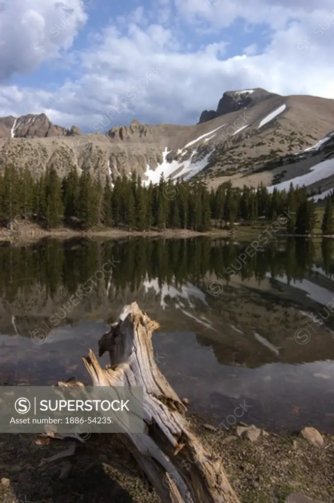 MOUNT WHEELER (13,063 FEET) in GREAT BASIN NATIONAL PARK is reflects in  TERESA LAKE in the summer - NEVADA