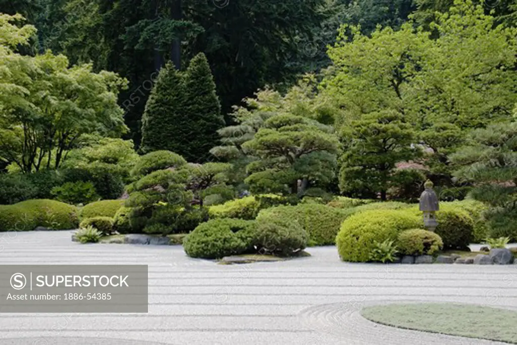 Raked sand and manicured trees & plants at the Portland Japanese garden, considered the most authentic outside of Japan - PORTLAND, OREGON