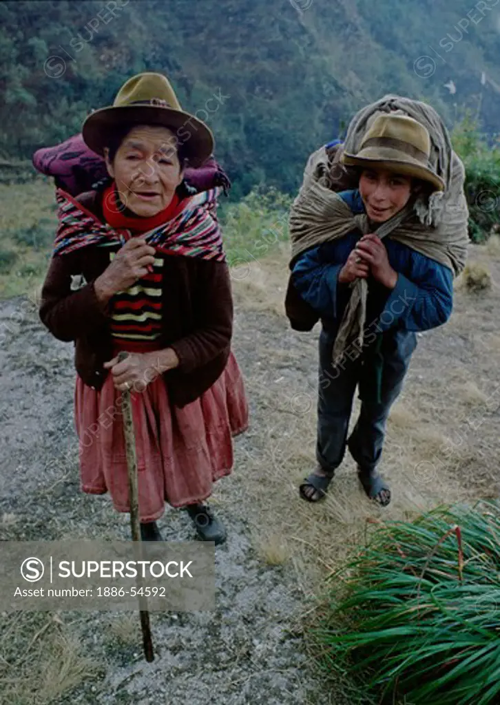 QUECHUA grandmother & grandson hike along the INCA TRAIL TO MACHU PICCHU - PERUVIAN ANDES