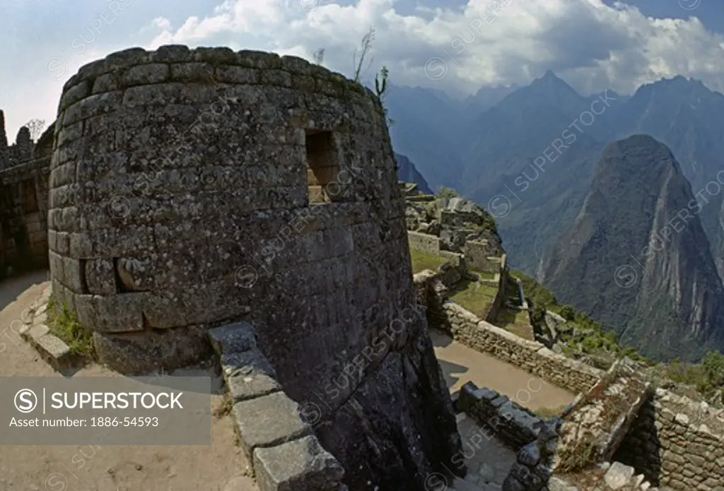 TEMPLE OF THE SUN at the INCA RUINS OF MACHU PICCHU - PERUVIAN ANDES