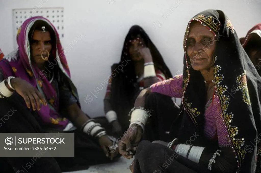 Nomadic BANJARI WOMAN wearing a BEADED HEAD SHAWL at the PUSHKAR CAMEL FAIR - RAJASTHAN, INDIA