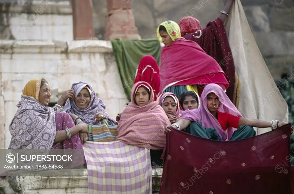 RAJASTHANI WOMEN dry their CLOTHING during the PUSHKAR CAMEL FAIR - RAJASTHAN, INDIA