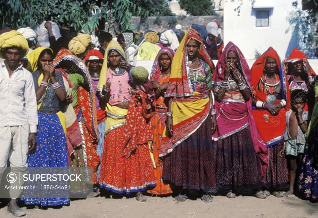 BANJARI WOMEN with EMBROIDERED BLOUSES and HEAD SHAWLS at the PUSHKAR CAMEL FAIR - RAJASTHAN, INDIA