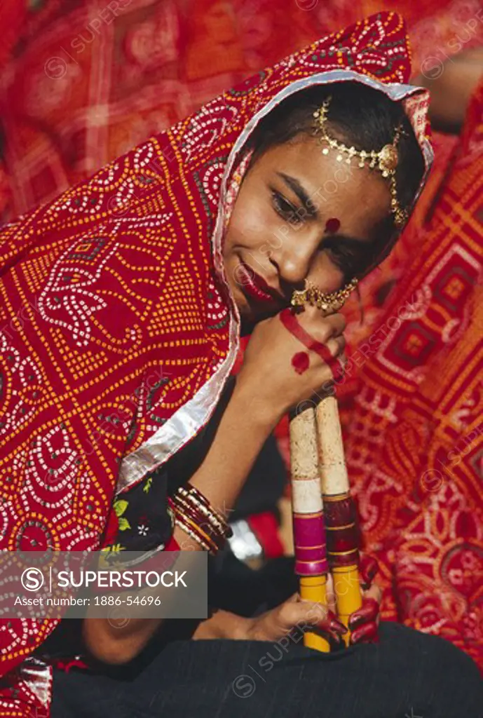 Portrait of a RAJASTHANI GIRL during a TRADITIONAL DANCE performance at the PUSHKAR CAMEL FAIR - RAJASTHAN, INDIA