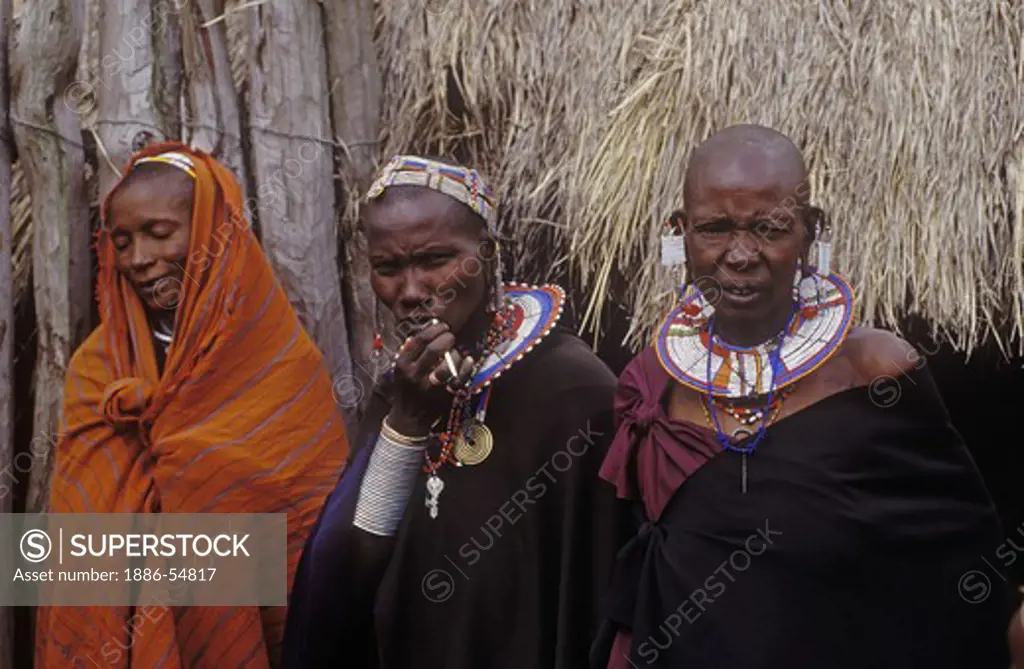 MASSAI women wear the beautifully beaded jewelry they are famous for in their village on the rim of NGORONGORO CRATER - TANZANIA