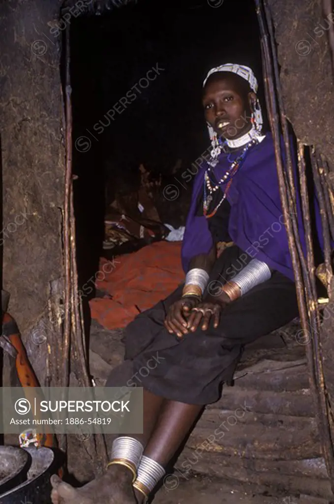 A MASSAI woman (chiefs wife), adorned with tribal JEWELRY in her village along the rim of NGORONGORO CRATER, TANZANIA