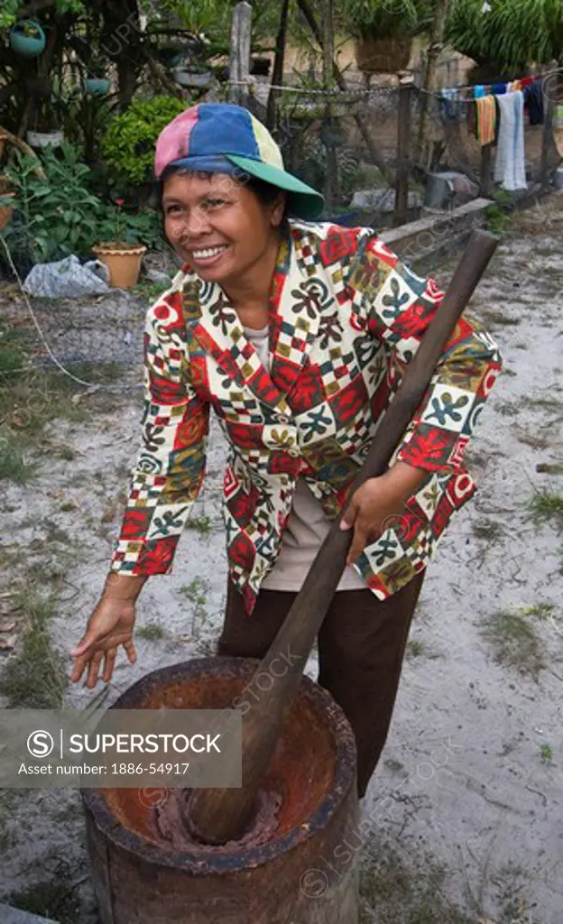 Thai woman makes shrimp paste in the village of Tung Nang Dam located on the North Andaman Sea - THAILAND