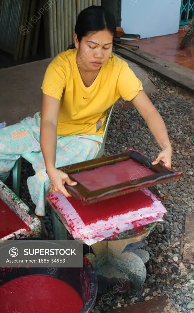 Thai woman making hand made paper for cards, a development project funded by North Andaman Tsunami Relief - KURABURI, THAILAND