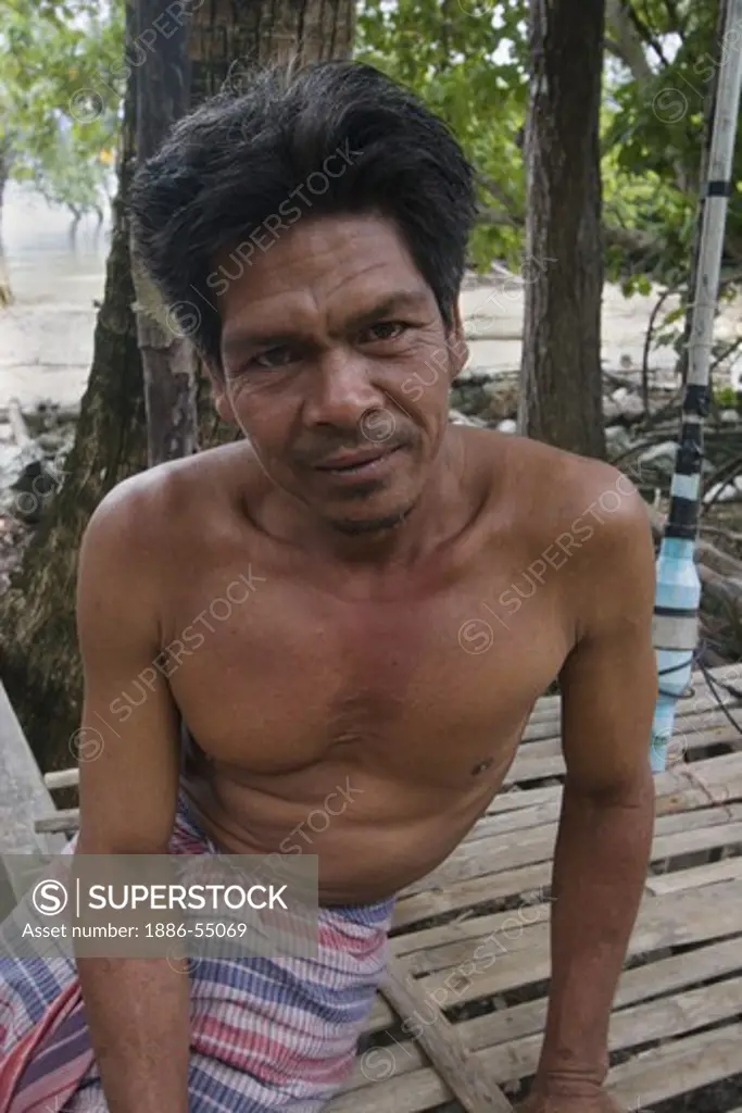 The Moken in Thailand still fish but now live in villages and have given up their traditional nomadic life of living in houseboats - KO PHRATHONG ISLAND,  THAILAND