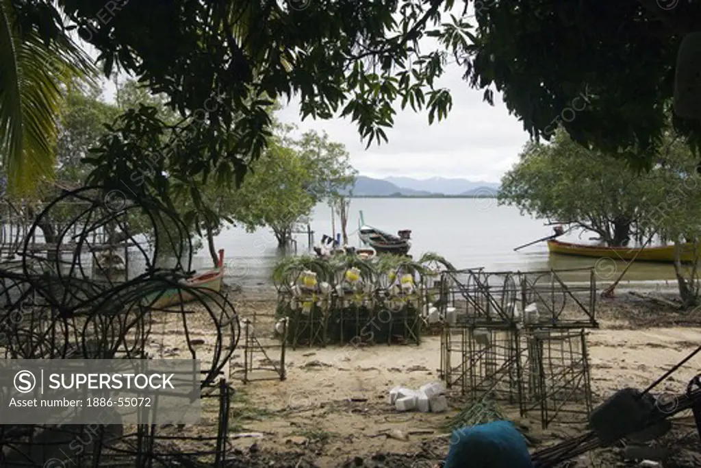 Moken fishing traps in a village near KO PHRATHONG ISLAND,  THAILAND