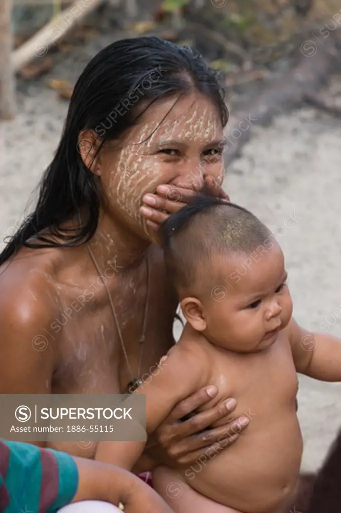 Moken (sea gypsy) women & child in her village on Ko Surin Thai Island in Mu Ko Surin National Park -  ANDAMAN SEA, THAILAND