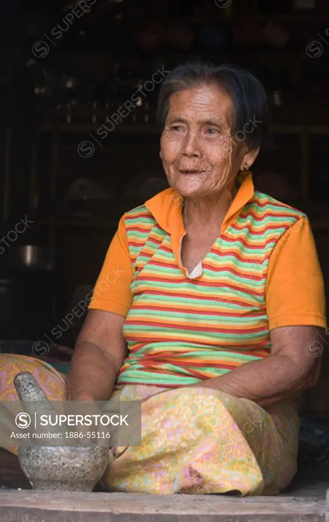 Moken (sea gypsy) woman in her village on Ko Surin Thai Island in Mu Ko Surin National Park -  NORTH ANDAMAN SEA, THAILAND