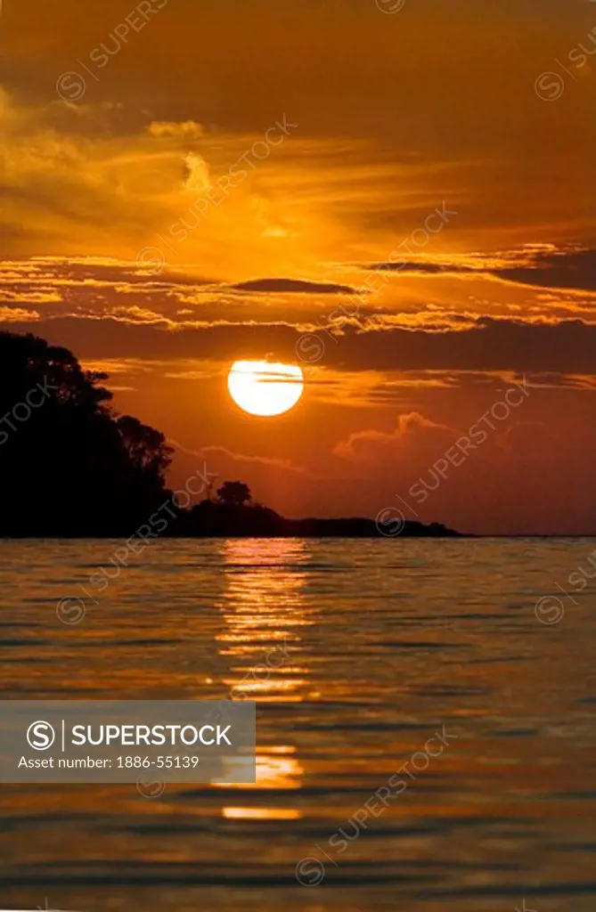 A tropical sunrise on the North Andaman Sea off the coast of Ko Surin Nuea Island in Mu Ko Surin National Park, THAILAND