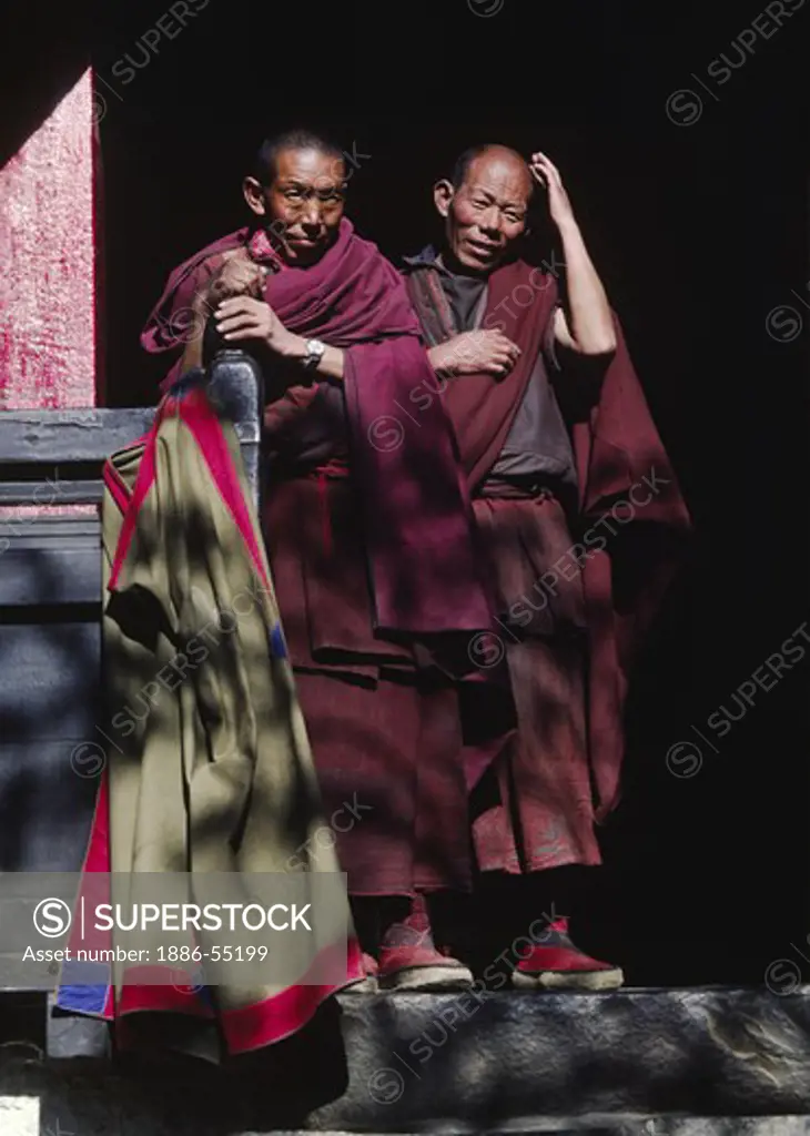 Tibetan monks in a doorway Tashilhunpo Monastery - Shigatse, Tibet
