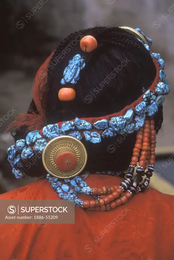 TURQUOISE, CORAL & GOLD decorate this TIBETAN WOMAN'S hair - LHASA, TIBET