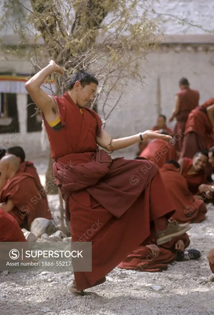 MONKS DEBATE the finer points of TIBETAN BUDDHISM in this historic form of learning at SERA MONASTERY - LHASA, TIBET