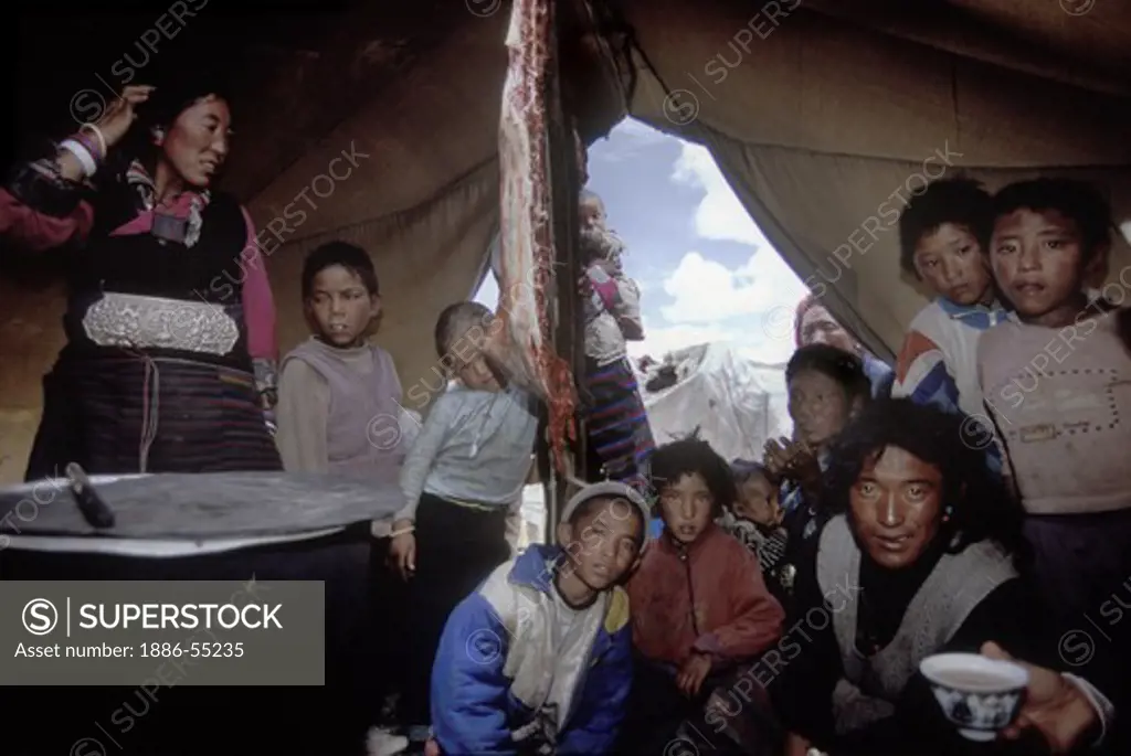 A FAMILY of DROKPAS (Tibetan nomadic yak herders) inside their TENT on the TIBETAN PLATEAU on route to MOUNT KAILASH