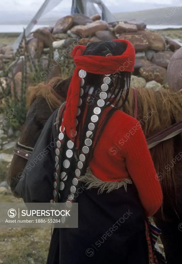 TIBETAN WOMAN with antique COIN HAIR PIECE at LAKE MANASAROVAR (4550M), BUDDHIST & HINDU site - KAILASH, TIBET