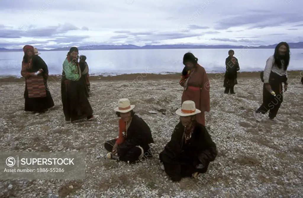 TIBETAN PILGRIMS at LAKE MANASAROVAR (4550M), gather sacred herbs - KAILASH, TIBET