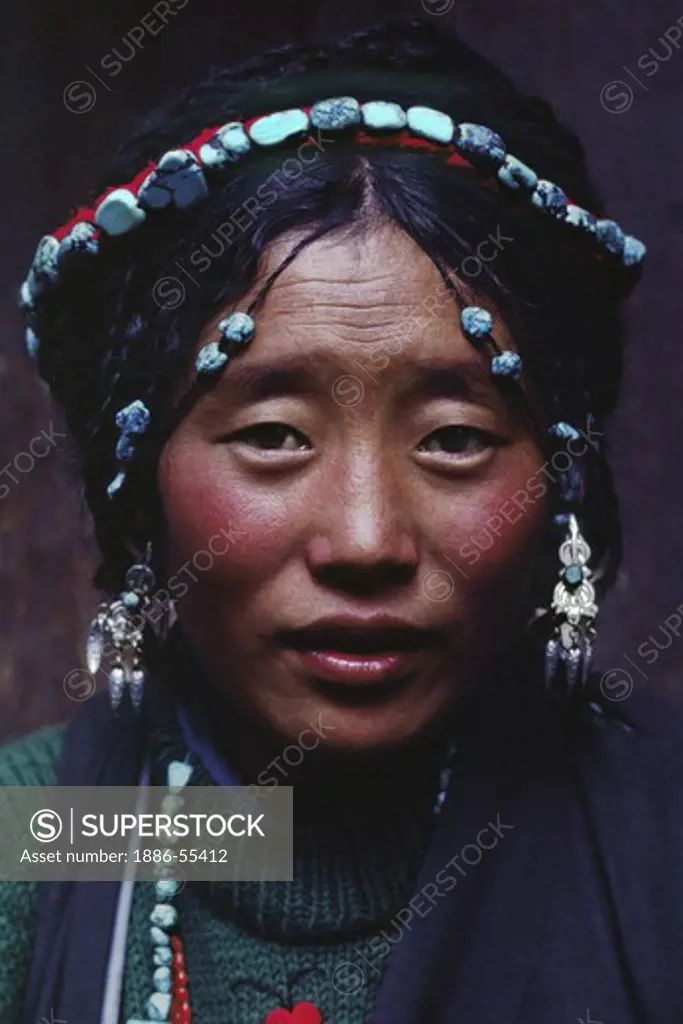 Tibetan beauty with elaborate tourquoise headdress - Barkhor,Lhasa.